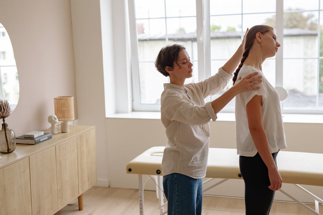 Physical Therapist Giving a Massage to a Woman